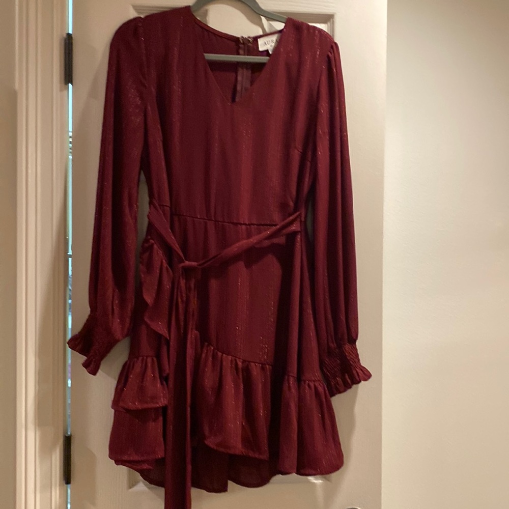 Long sleeve maroon dress with ruffle bottom and tie waist